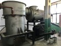 Kocioł na odpady drewnopochodne 150 kW. Zdjęcie przedstawia piec do spalania płyt wiórowych, MDF i HDF.