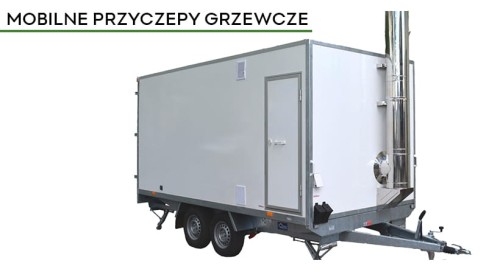 Mobilna przyczepa grzewcza na olej opałowy 250 kW. Zdjęcie przedstawia białą przyczepę z kominem.